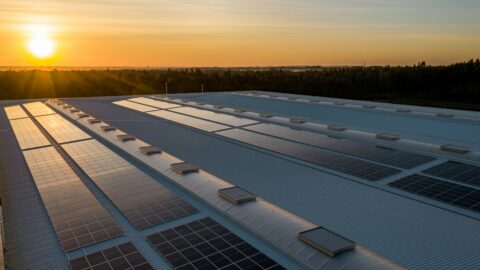 Solar panels on roof at sundown.